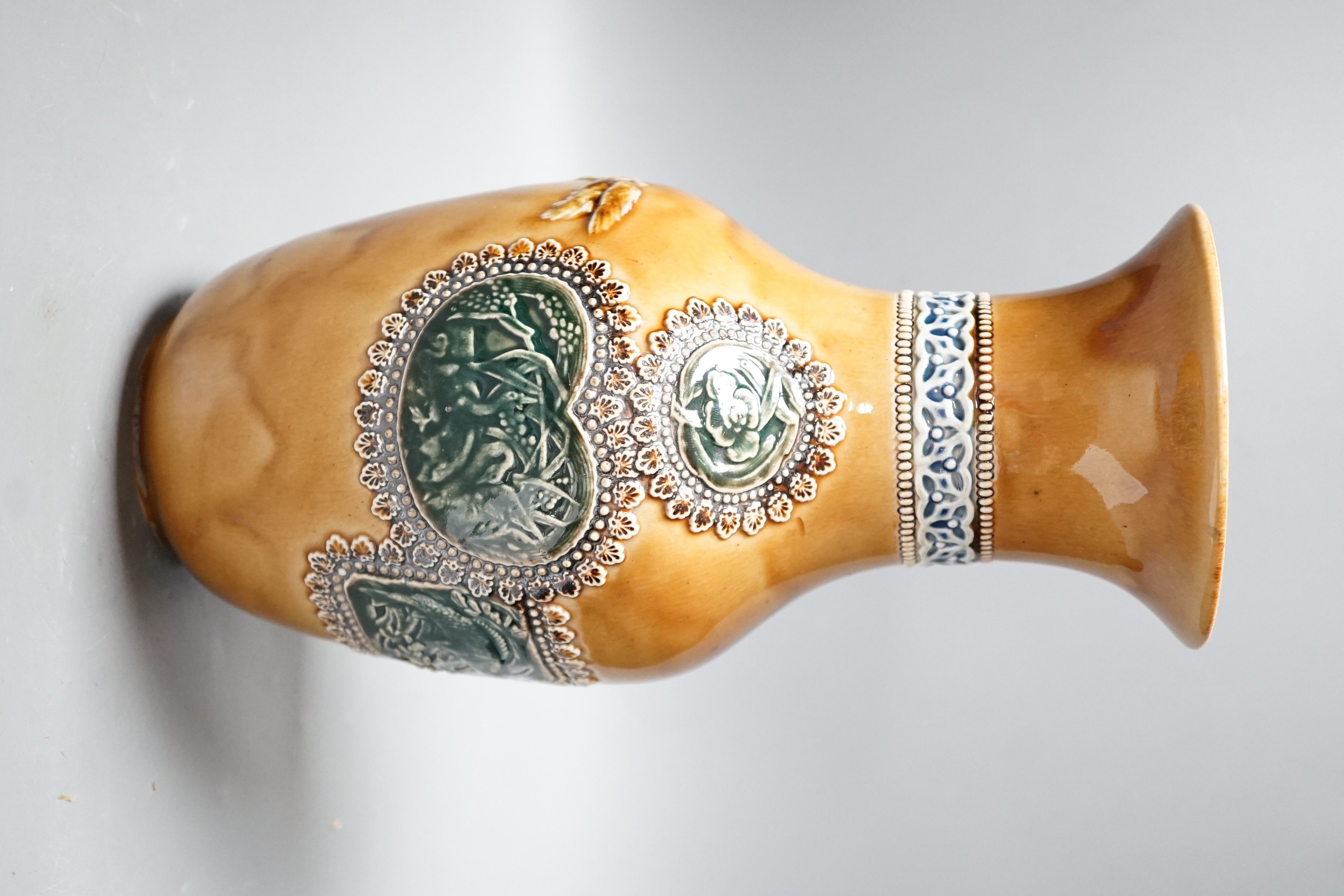 A Doulton Lambeth Aesthetic period stoneware vase, c.1885, decorated with Japanese cartouches and cranes in-flight, 27.5cms high